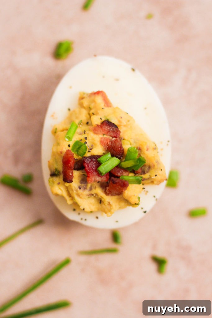Garnished with chives and bacon