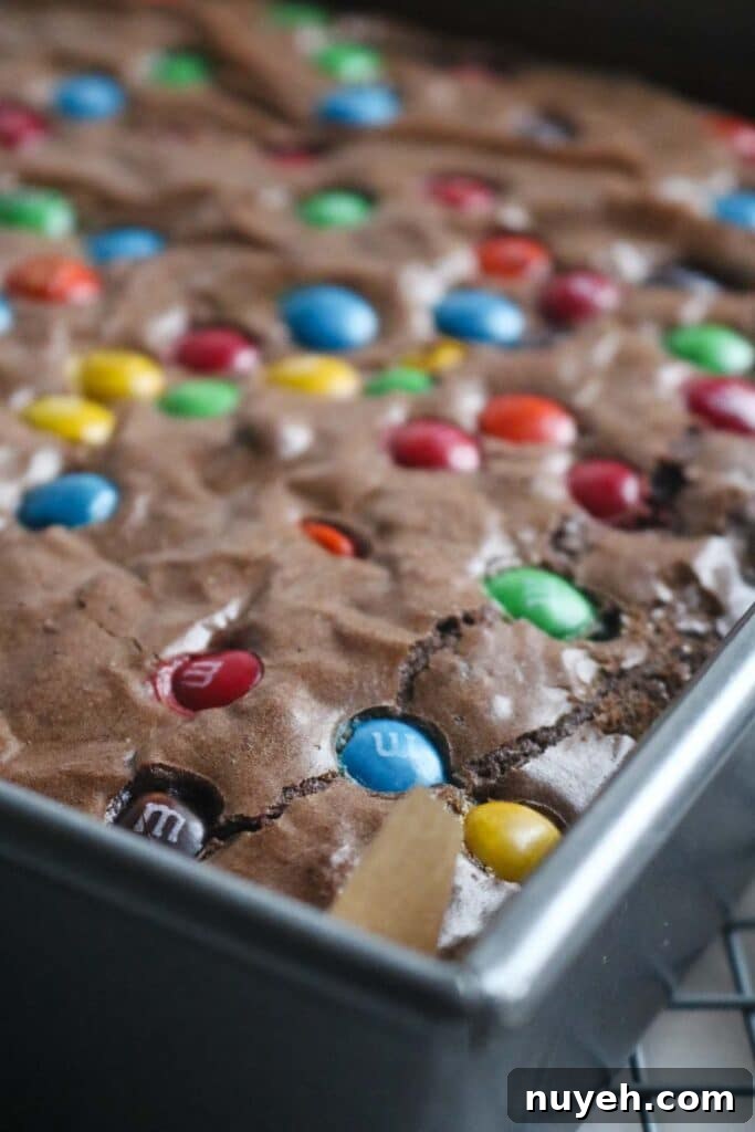 freshly baked thicker M&M brownies cooling.