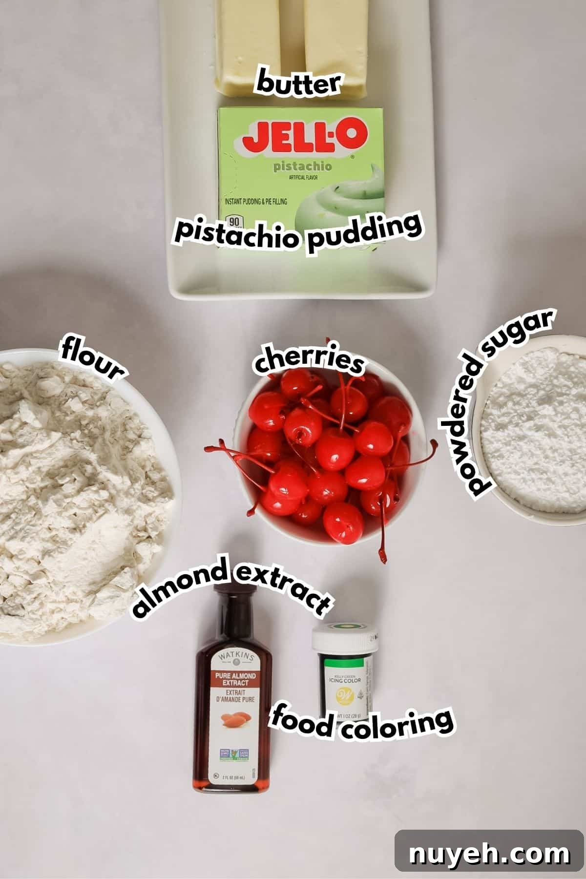 Bowls of ingredients labelled with text on a counter.
