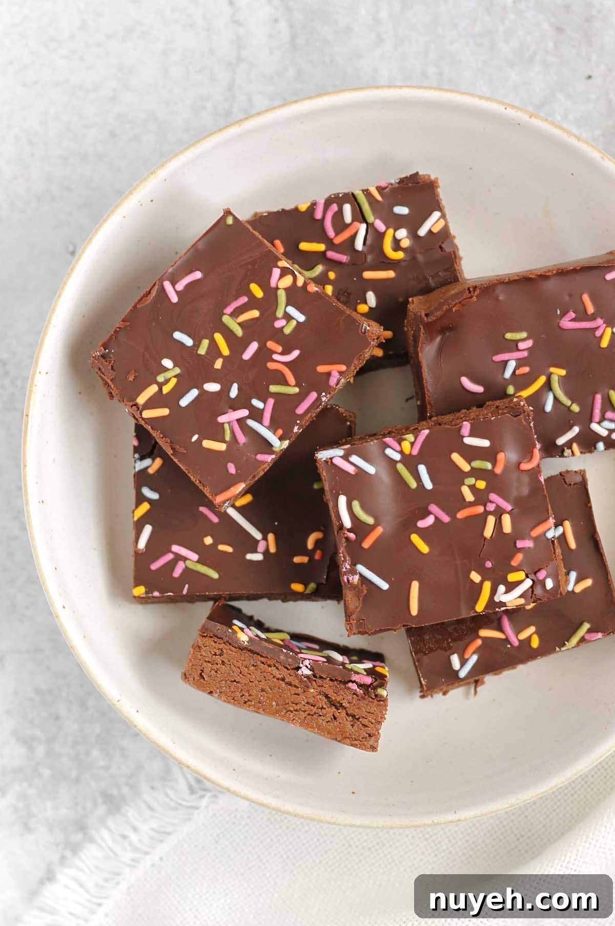 Chocolate protein with sprinkles laid out on a white plate.