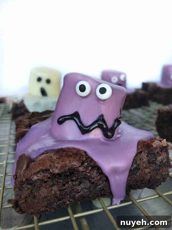 purple marshmallow monster brownie on cooling rack