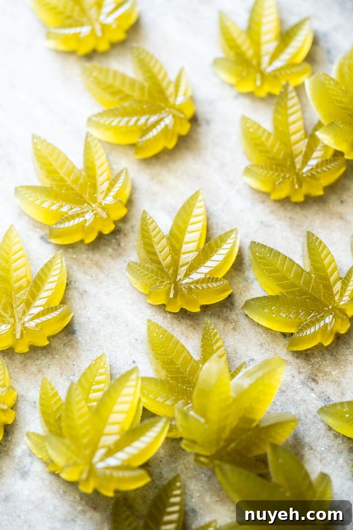 Green keto CBD gummies in cannabis leaf shape