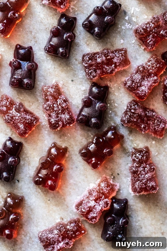Overhead shot of sour and raspberry keto gummies on marble