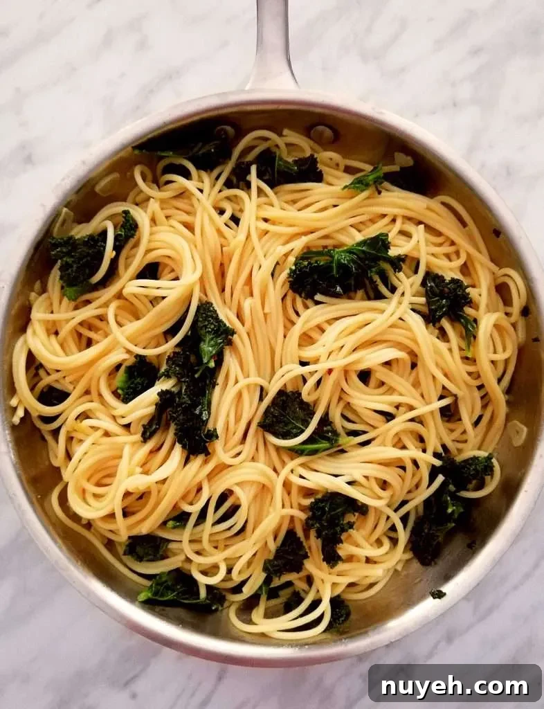 spicy kale pasta in skillet overhead
