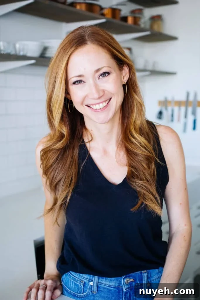Tessa in her white kitchen.