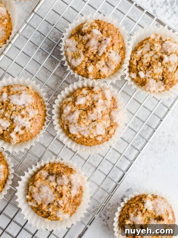 Pumpkin muffins on a wire rack.