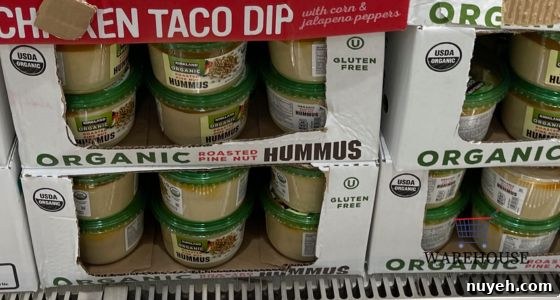 Kirkland Signature Hummus from Costco with pita and veggies — simple healthy Costco Thanksgiving appetizer.