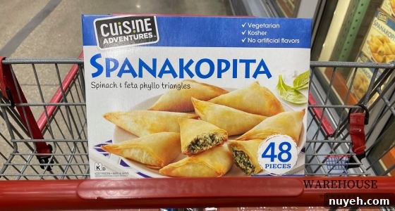 Costco Cuisine Adventures Spanakopita baked golden brown and served on a tray — flaky Costco Thanksgiving appetizer.
