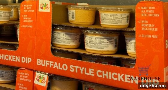 Good Foods Buffalo Chicken Dip from Costco in a bowl with crackers and celery — popular Costco Thanksgiving food.