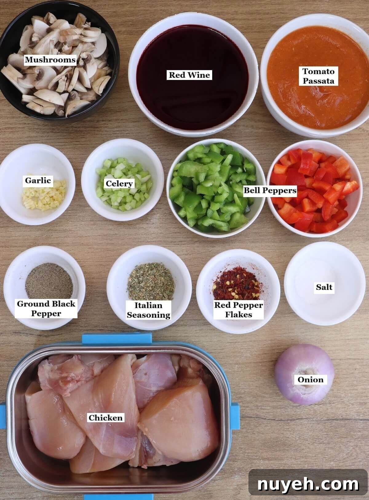 individually labelled ingredients to make chicken cacciatore are laid out on a table.