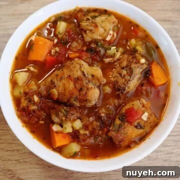 mediterranean chicken stew served in a white bowl.