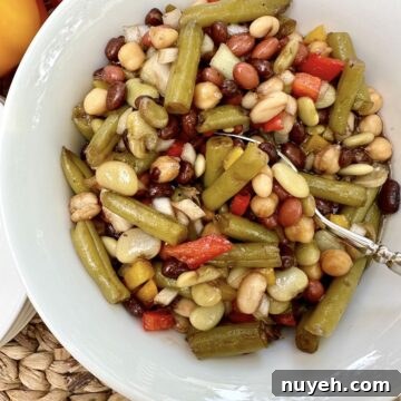 A spoon dishing up serving of bean salad.
