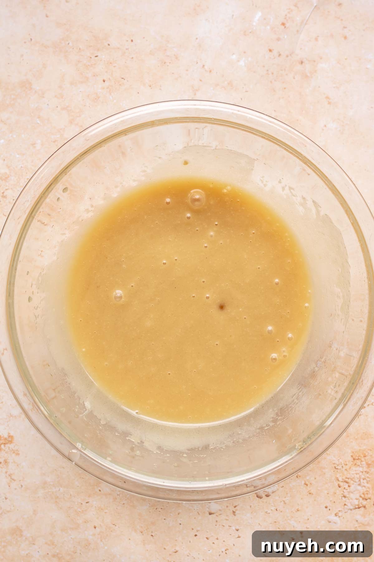 Wet ingredients whisked in a bowl.