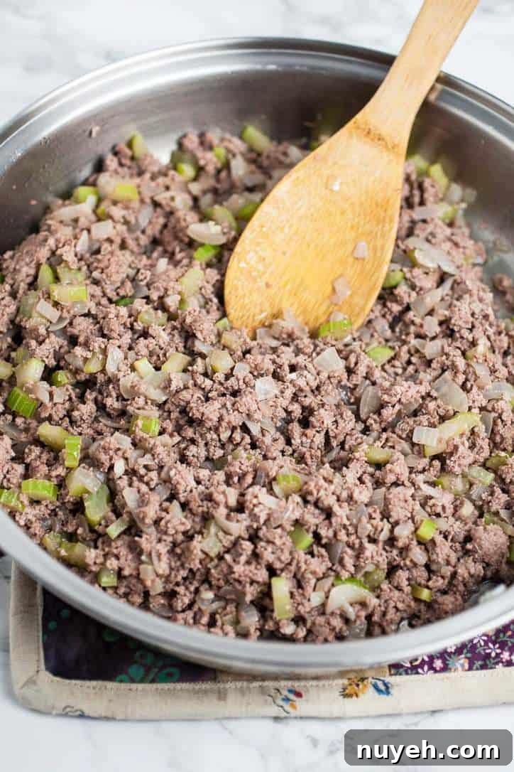 How to Thaw Ground Beef Safely: Refrigerator, Cold Water, Microwave 6 A photo of a pan of burger with celery and onions for homemade sloppy joe sauce