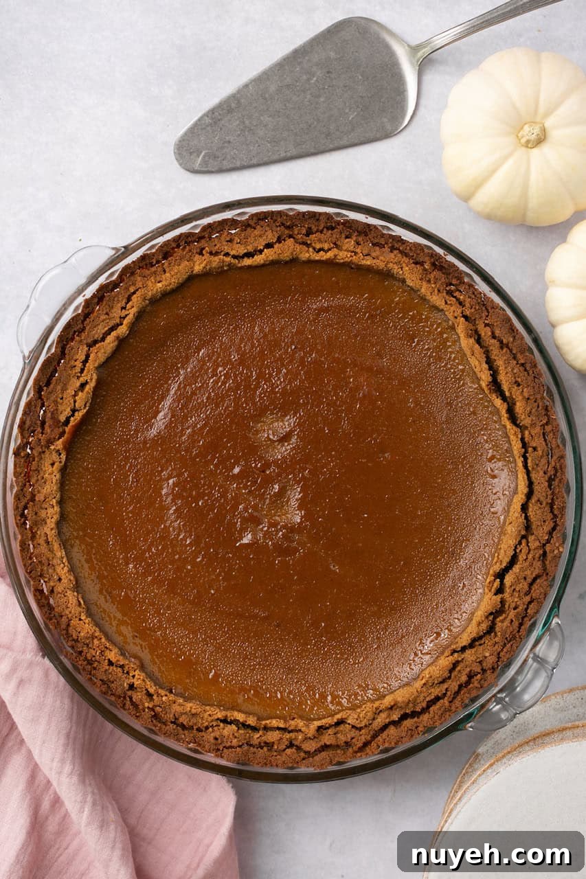 and overhead shot of a pumpkin pie with graham cracker crust 