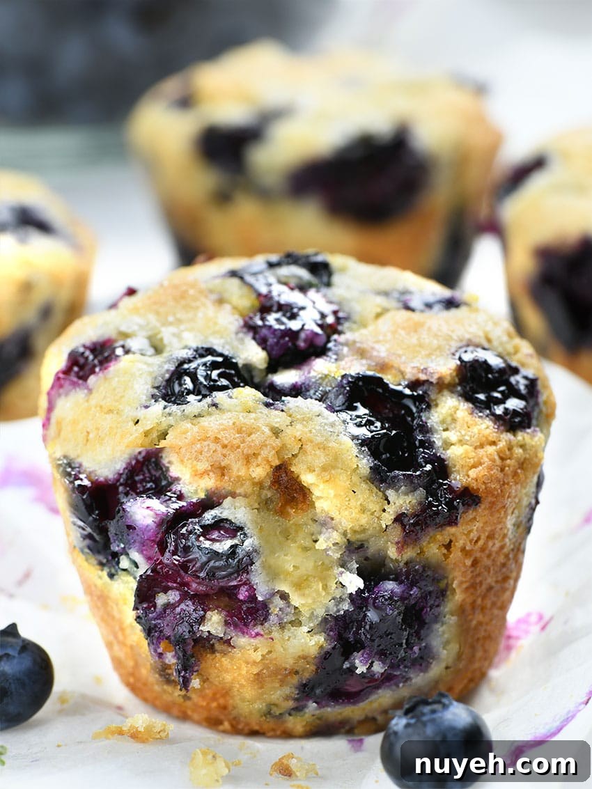 Big Blueberry Cobbler Muffins in focus.