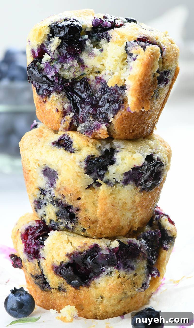 Three Blueberry Cobbler Muffins each on other.
