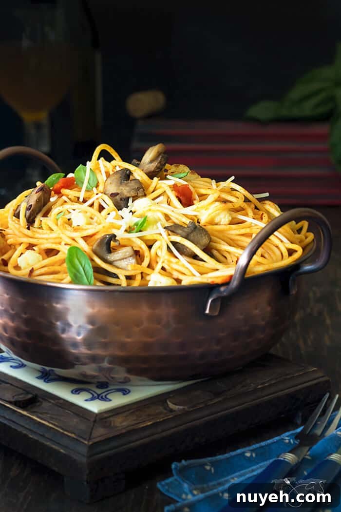 A bowl of caramelized cauliflower and mushroom spaghetti