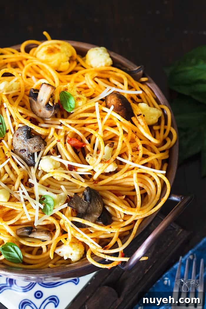 Overhead shot of spaghetti with cauliflower and mushrooms