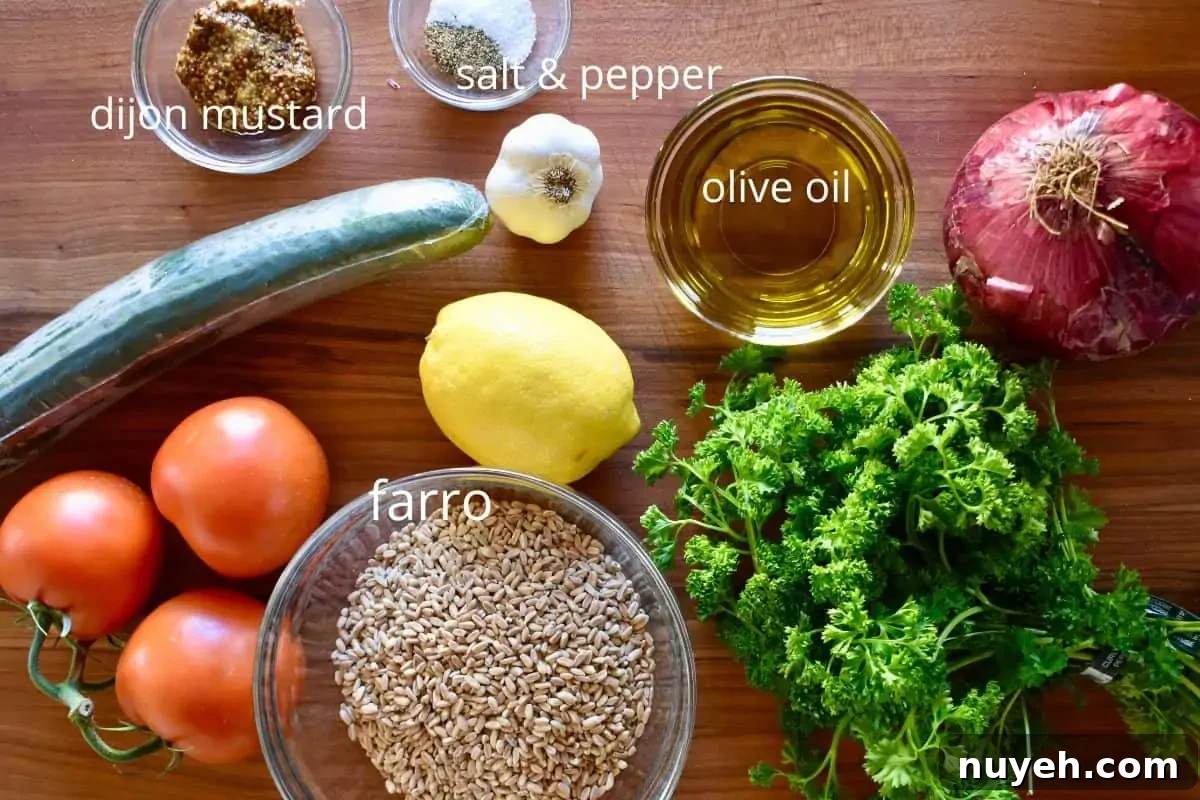 overhead photo of ingredients need to make recipe including lemon, parsley, tomatoes, cucumber, red onion, and garlic. 