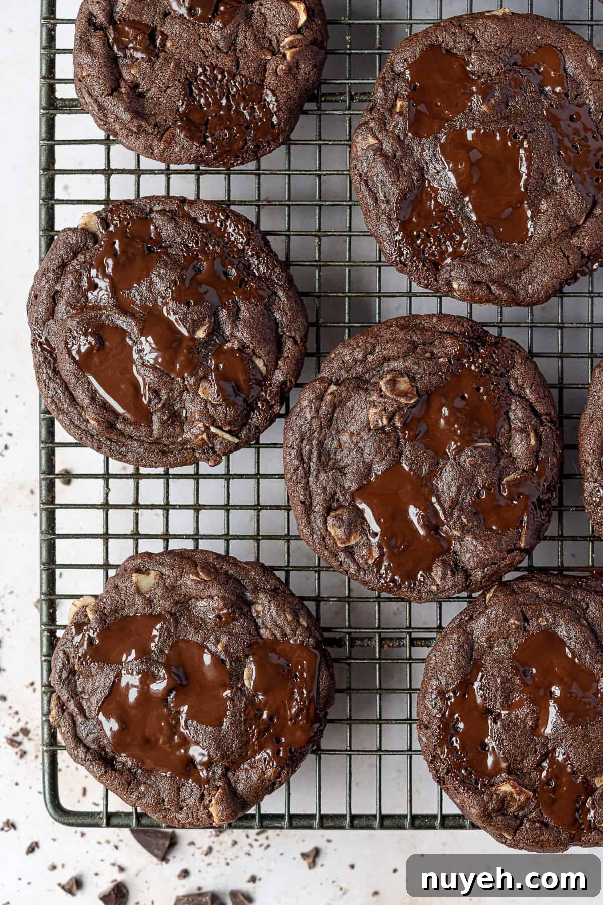Vegan double chocolate almond cookies on a wire cooling rack.