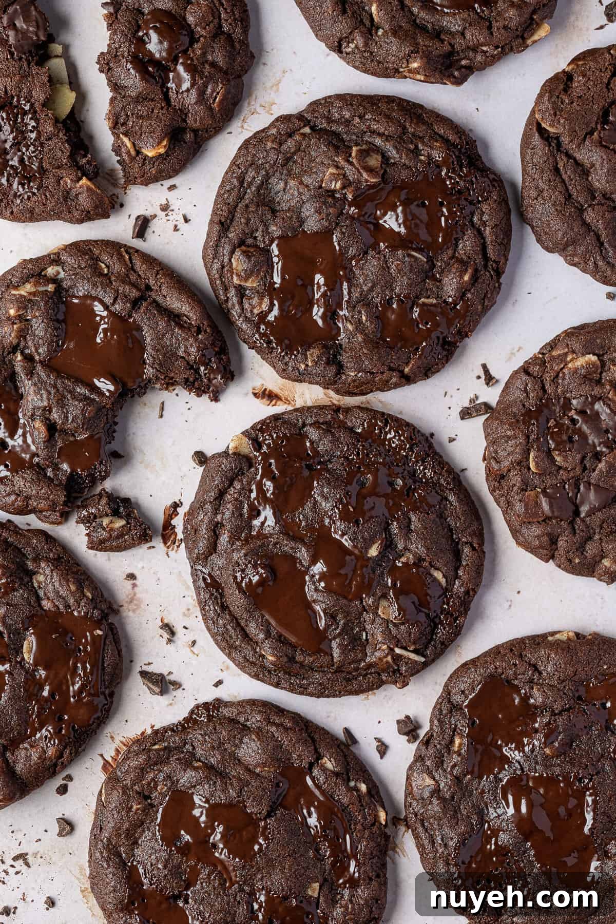 Double chocolate almond cookies on a marble surface.