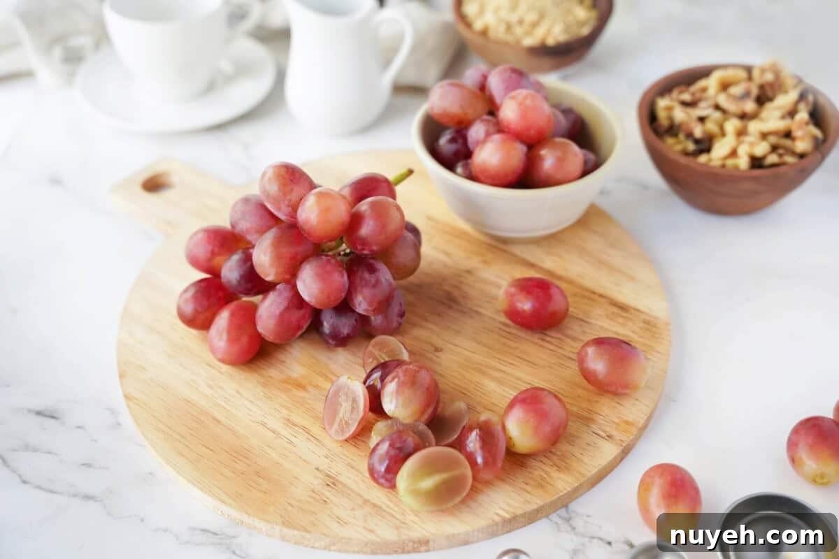 Sun World Red grapes on round wood board