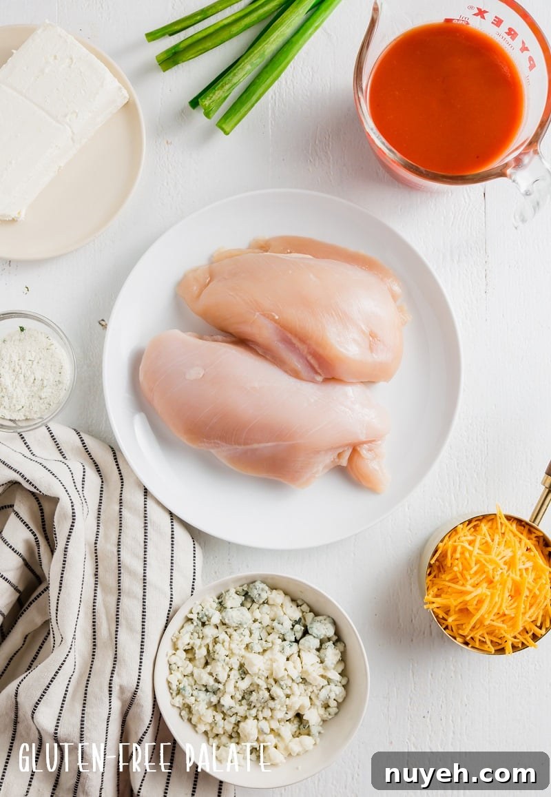 ingredients in buffalo chicken dip, chicken, spices, cream cheese, cheese, hot sauce