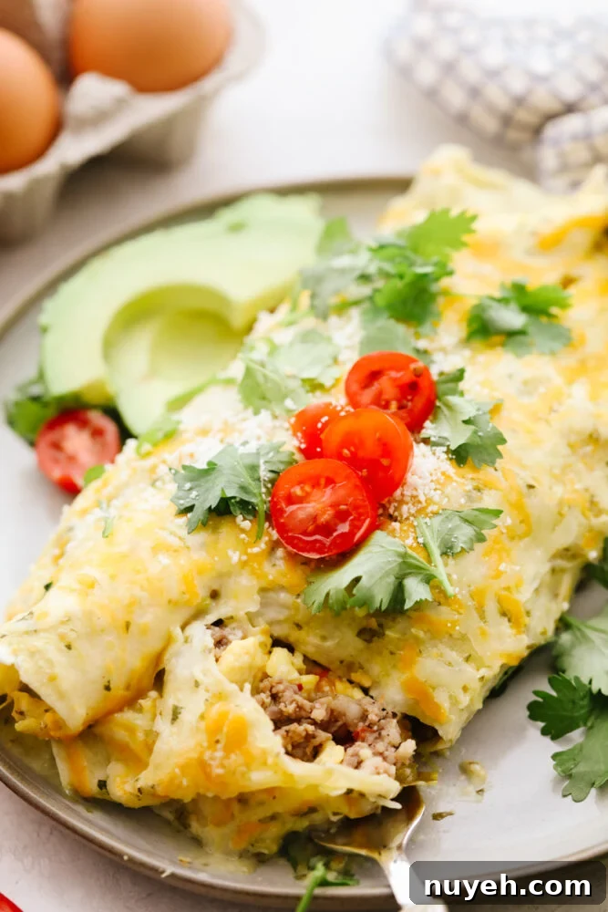 A close up of a breakfast enchilada with a fork cutting into it.