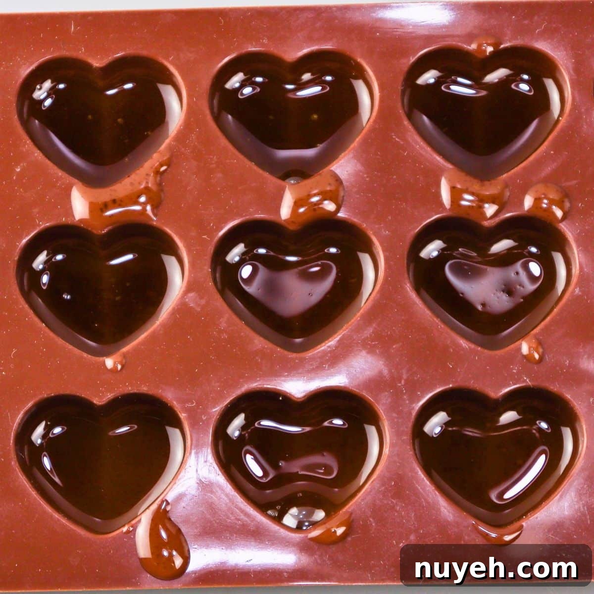 brown butter bites filled into a heart silicone mold
