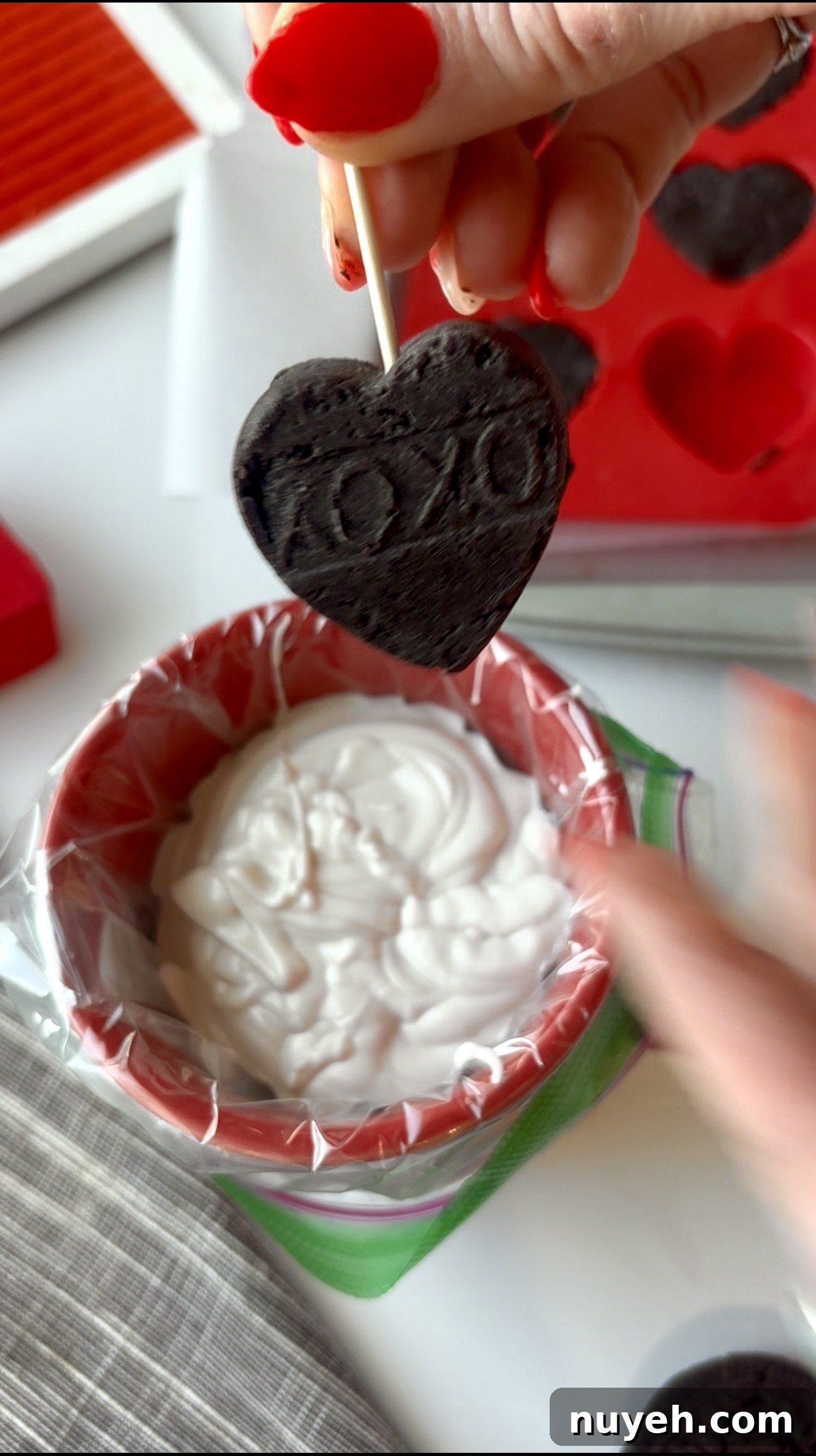 Dipping Oreo truffle in white chocolate