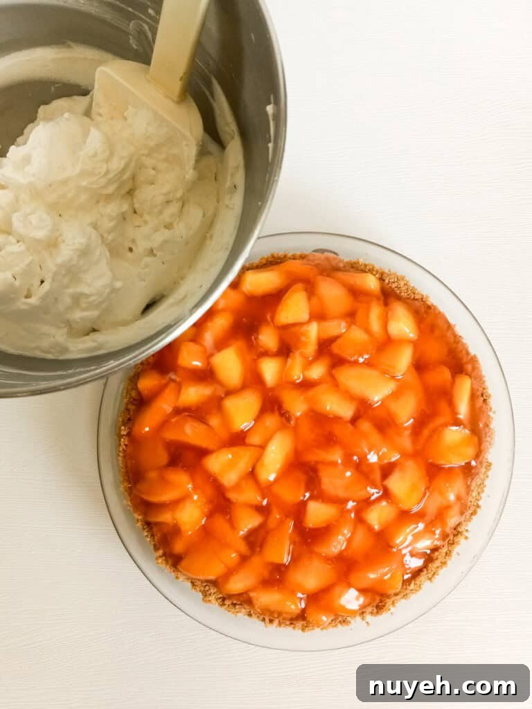 9" fresh peach pie and a bowl of whipped cream.