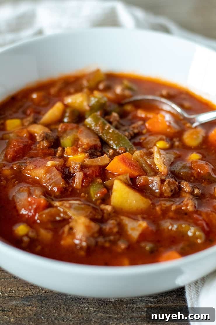 Bowl of soup with spoon.