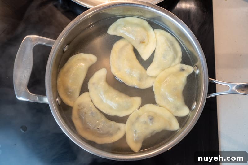 Authentic Polish Sauerkraut and Mushroom Pierogi Recipe 9 Boiling the pierogi