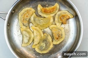 Authentic Polish Sauerkraut and Mushroom Pierogi Recipe 20 Frying the pierogi