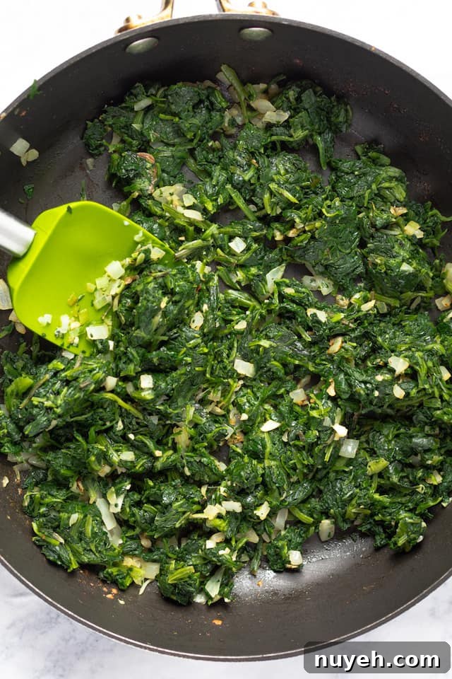 healthy creamed spinach recipe cooking in pan