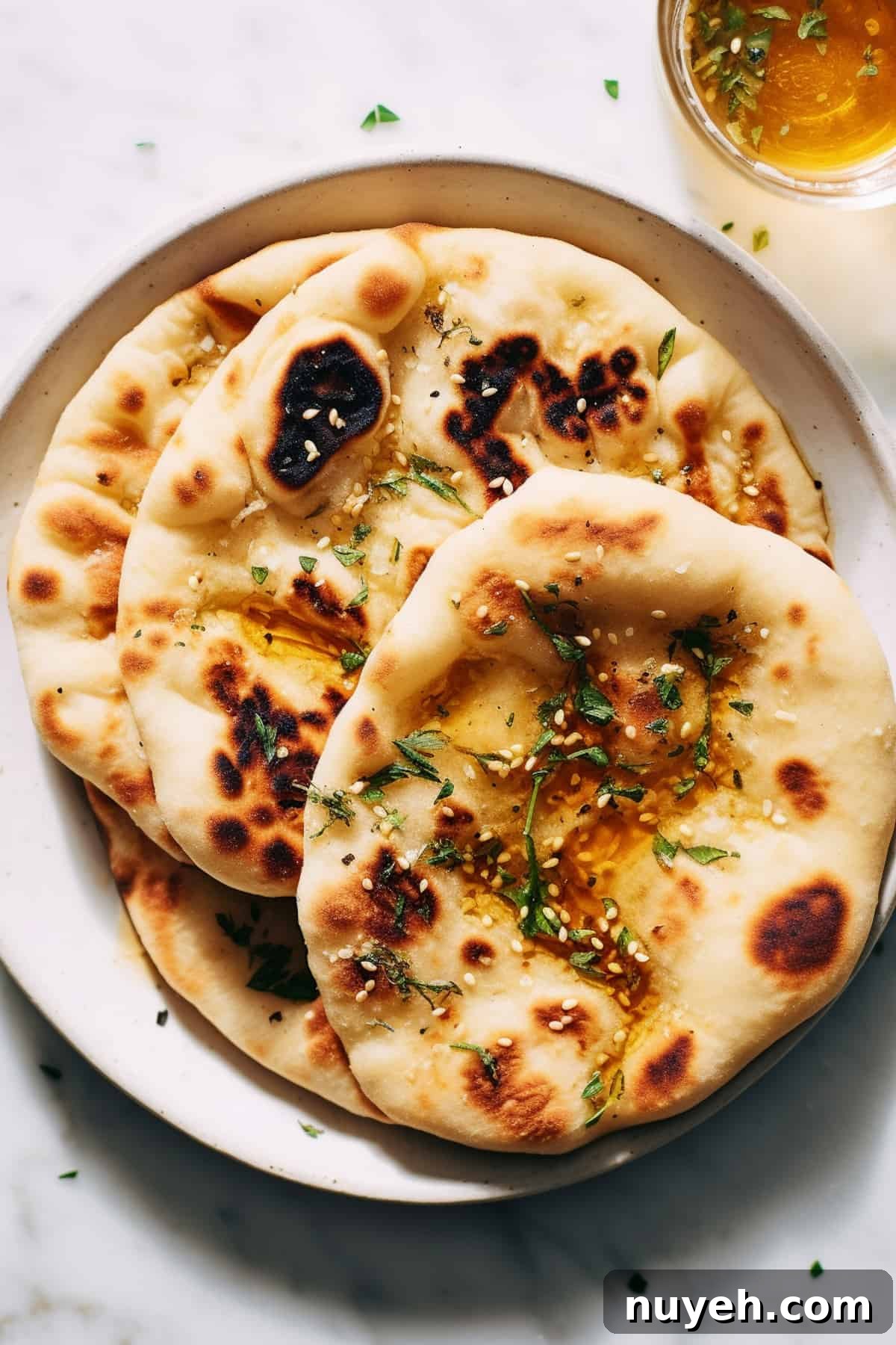 2 Ingredient naan bread on a white plate.