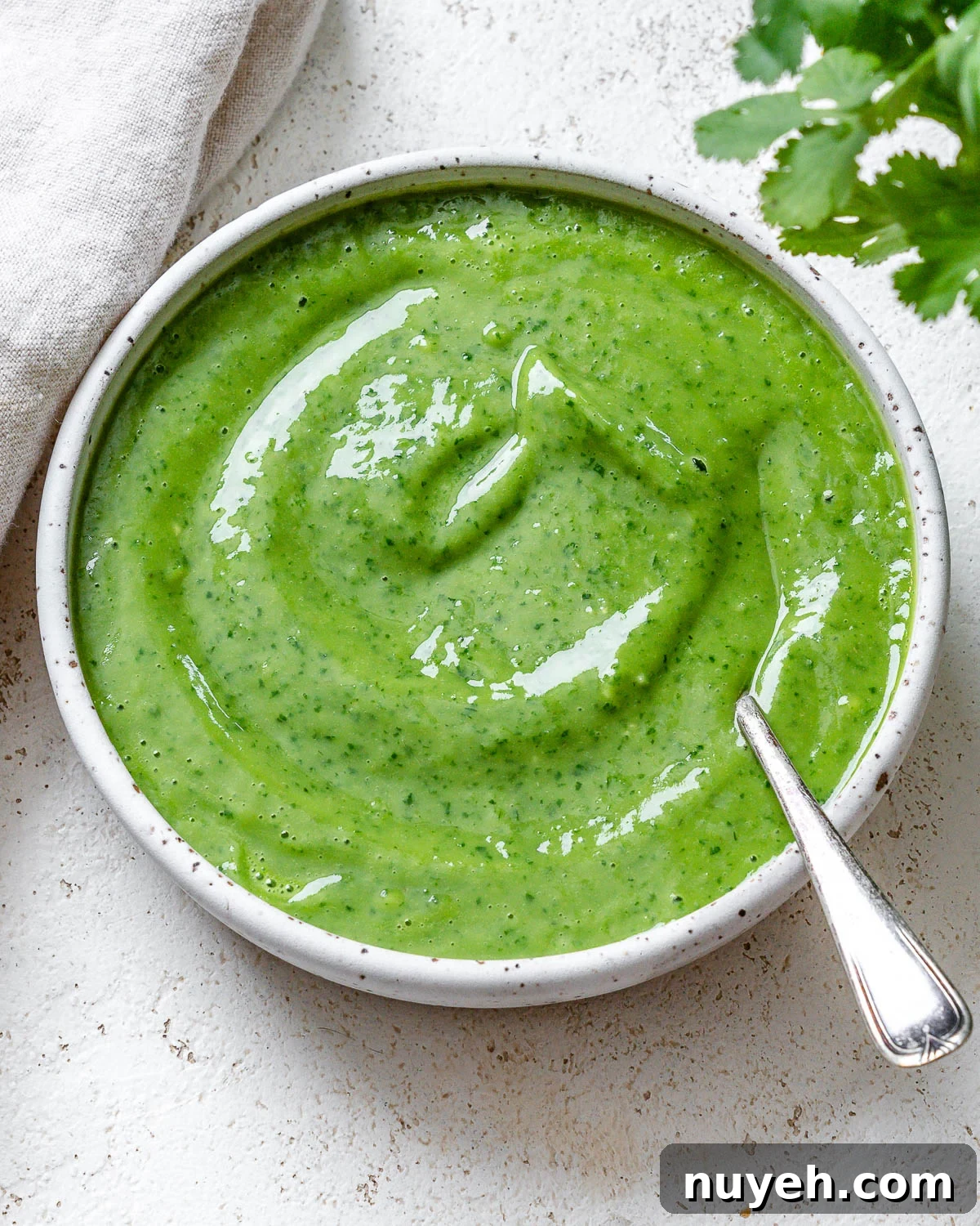completed Avocado Green Goddess Dressing in a bowl against a light surface