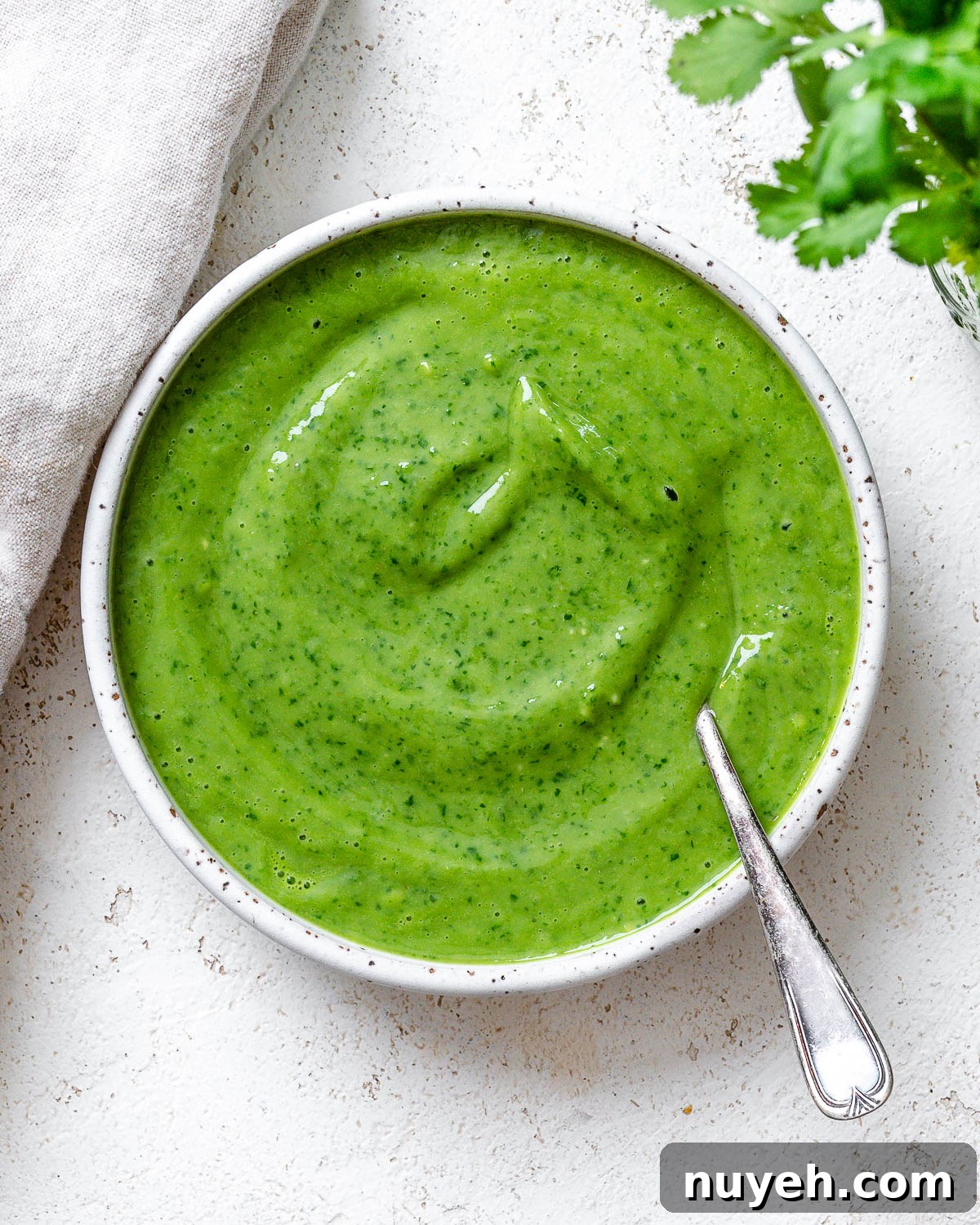 completed Avocado Green Goddess Dressing in a bowl against a light surface