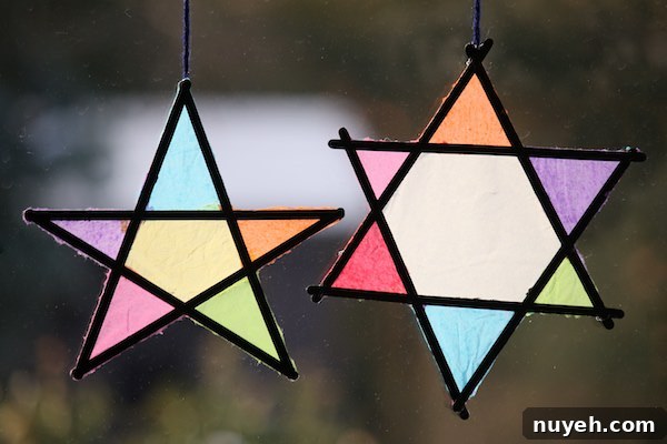 35 DIY Star Ornaments to Make for All Ages 4 tissue paper and popsicle stick stars side by side on window