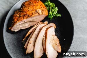 smoked turkey breast sliced on a serving platter horizontal