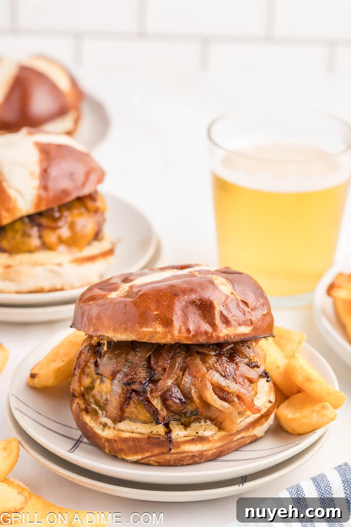 Close up image of pub burger on a plate with fries