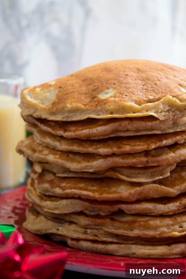 Festive Eggnog Pancakes with Cranberry Syrup Recipe 3 Stack of eggnog pancakes