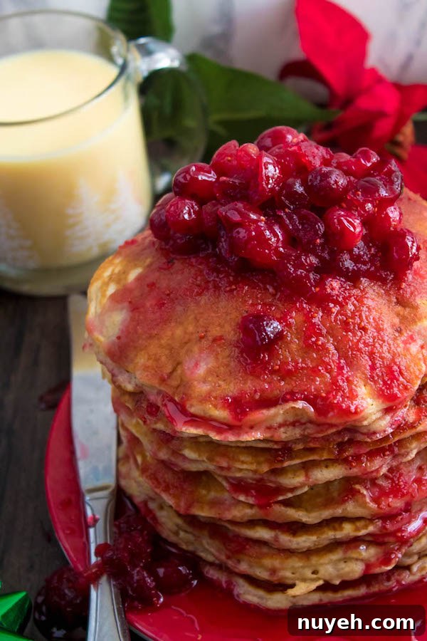 Festive Eggnog Pancakes with Cranberry Syrup Recipe 4 Eggnog pancakes topped with cranberry syrup