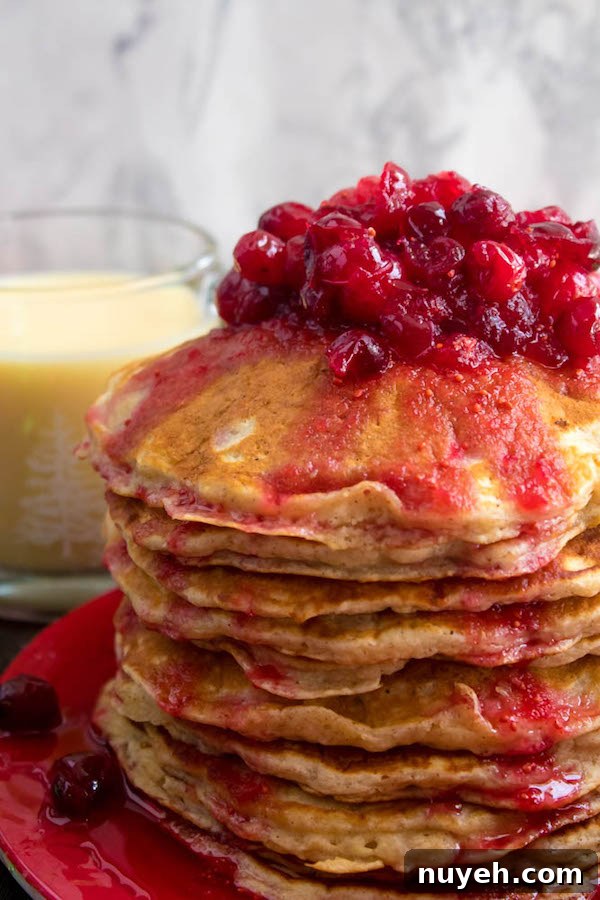 Festive Eggnog Pancakes with Cranberry Syrup Recipe 9 Festive pancake stack