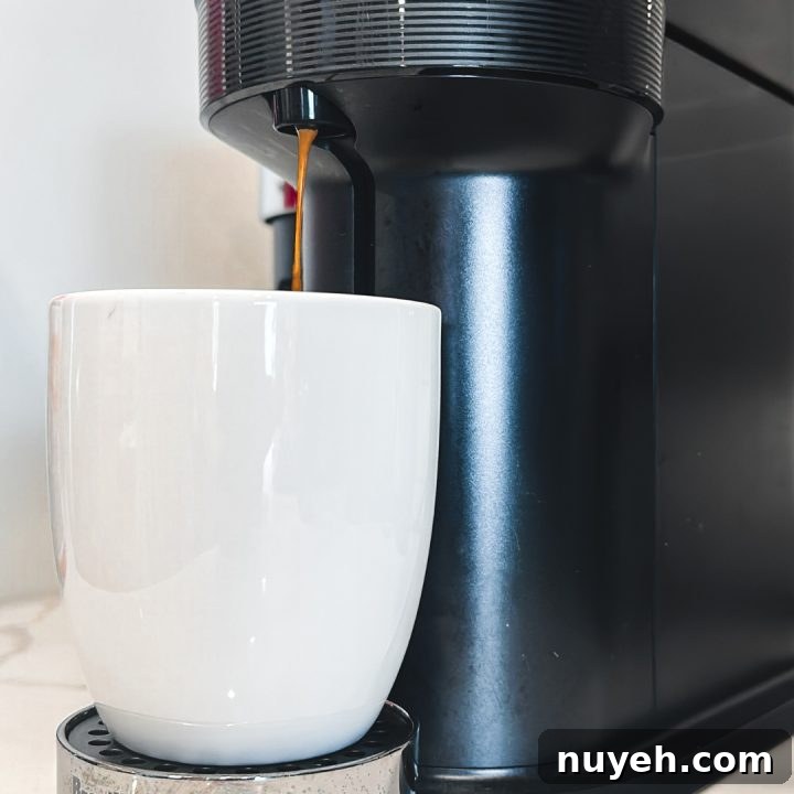Start by brewing a Nespresso Bianco Doppio coffee shot using your Nespresso machine or any espresso maker of your choice. Allow it to cool for a few minutes.