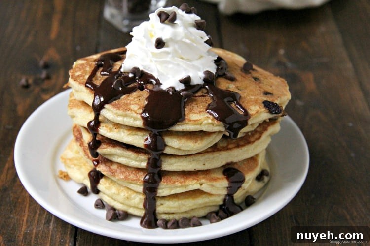 Almond Flour Chocolate Chip Pancakes - from scratch gluten free pancakes with chocolate chips homemade pancakes on plate with whipped cream and chocolate chips