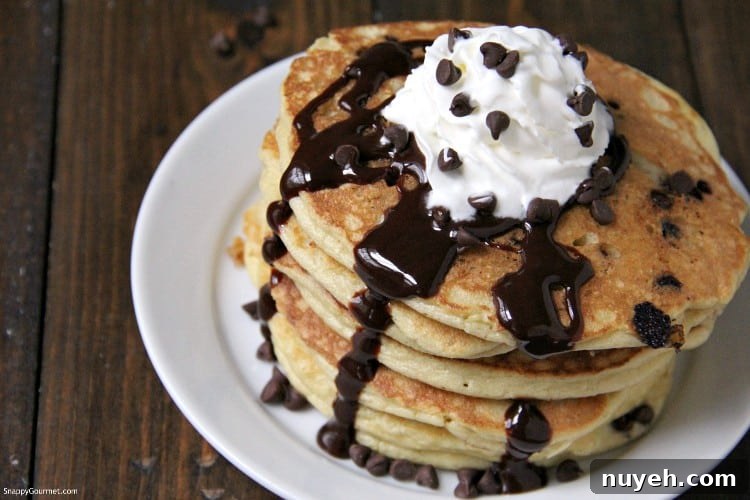 Almond Flour Chocolate Chip Pancakes - simple homemade gluten free pancake recipe fluffy homemade Almond Flour Chocolate Chip Pancakes recipe on plate with chocolate syrup