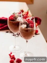 red wine chocolate mousse with berries in wine glasses