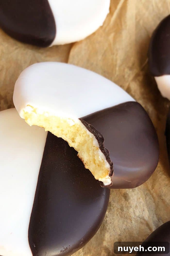 Easy Homemade Black and White Cookies From Scratch on Brown Paper- Partial Bite Removed